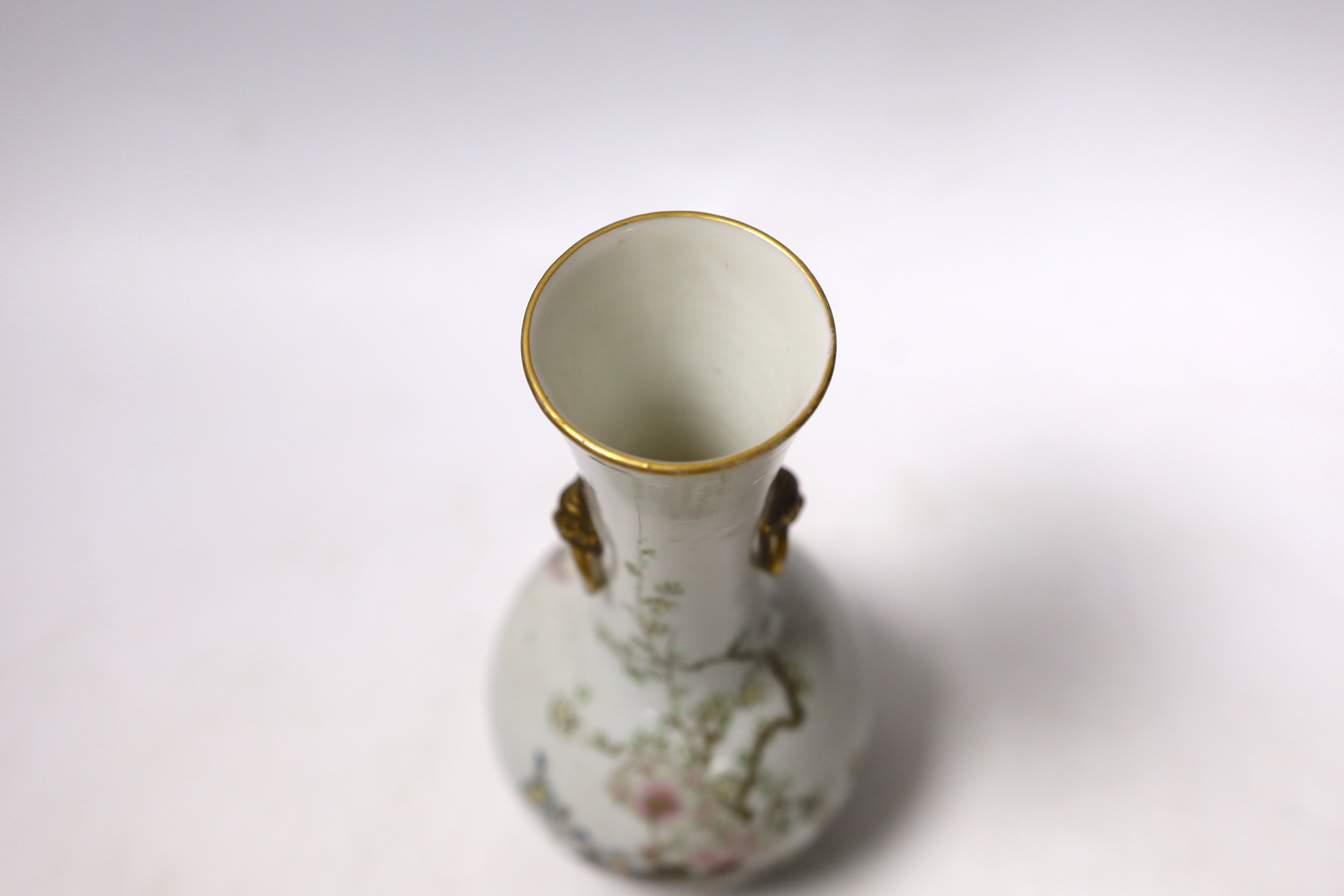 A Japanese bottle vase with lion mask and ring handles, together with a hardstone disc